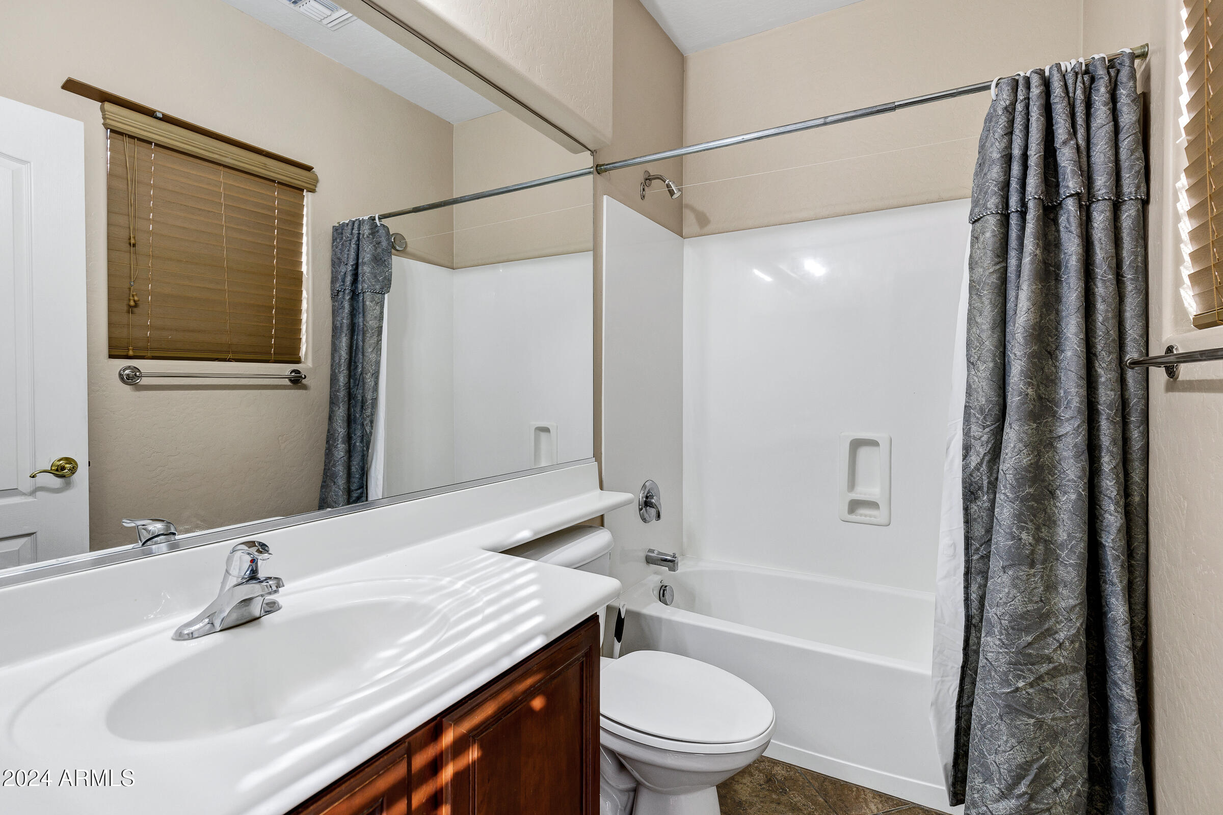 2801 West Silver Fox Way Phoenix, AZ 85045 - Photo 24 of 76 a bathroom with a sink toilet tub and shower