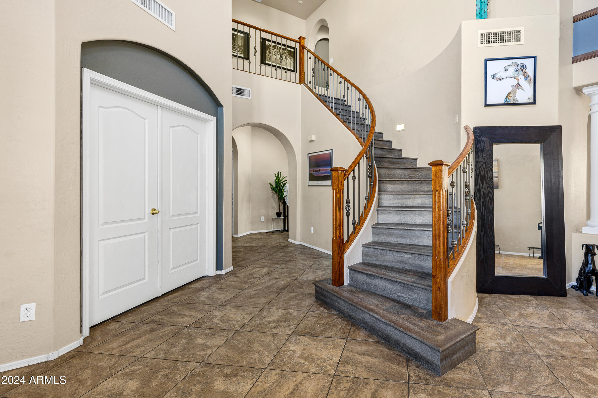 2801 West Silver Fox Way Phoenix, AZ 85045 - Photo 26 of 76 a view of entryway and hall with wooden floor