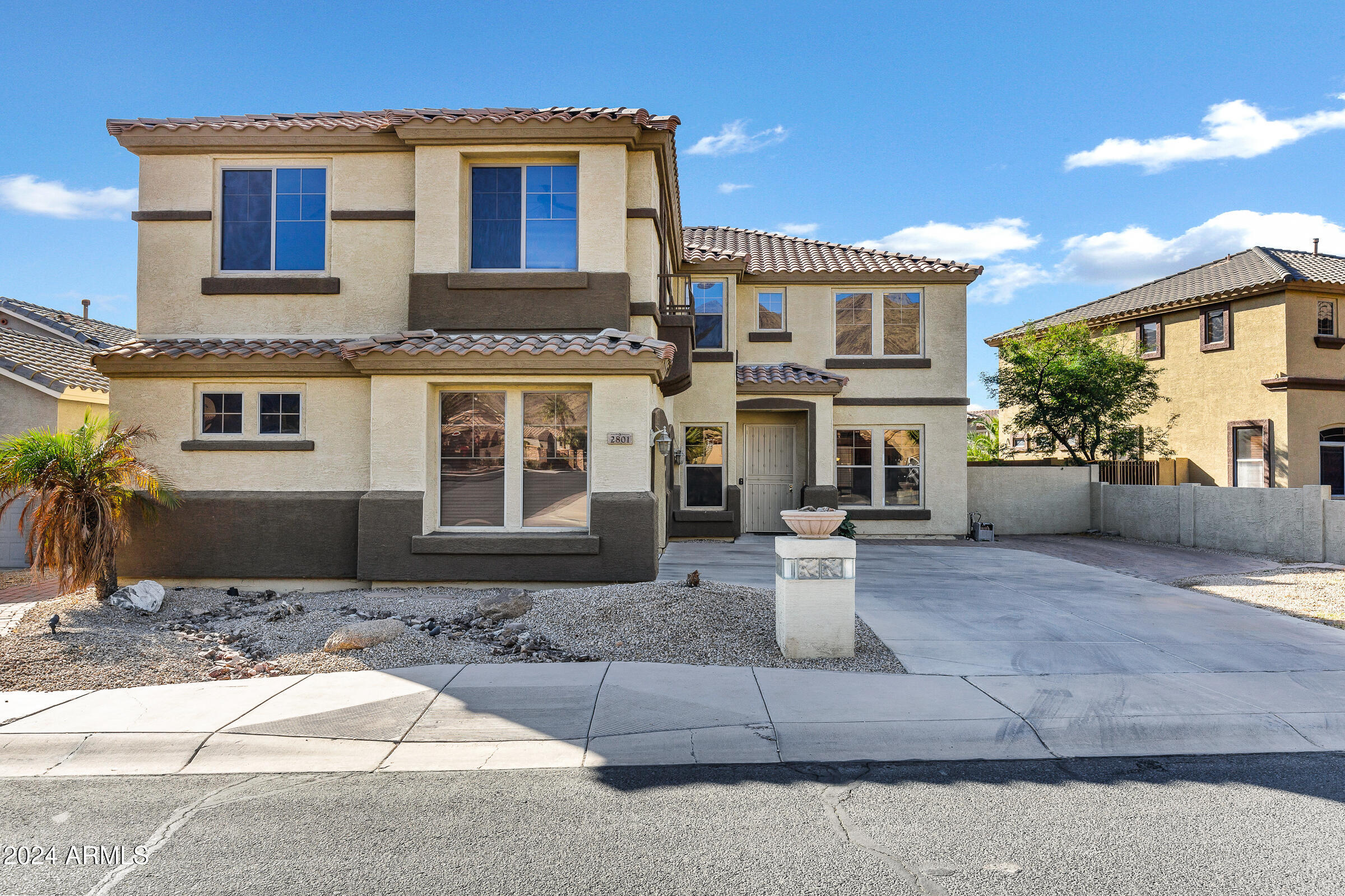 2801 West Silver Fox Way Phoenix, AZ 85045 - Photo 2 of 76 a front view of a house with garden and plants