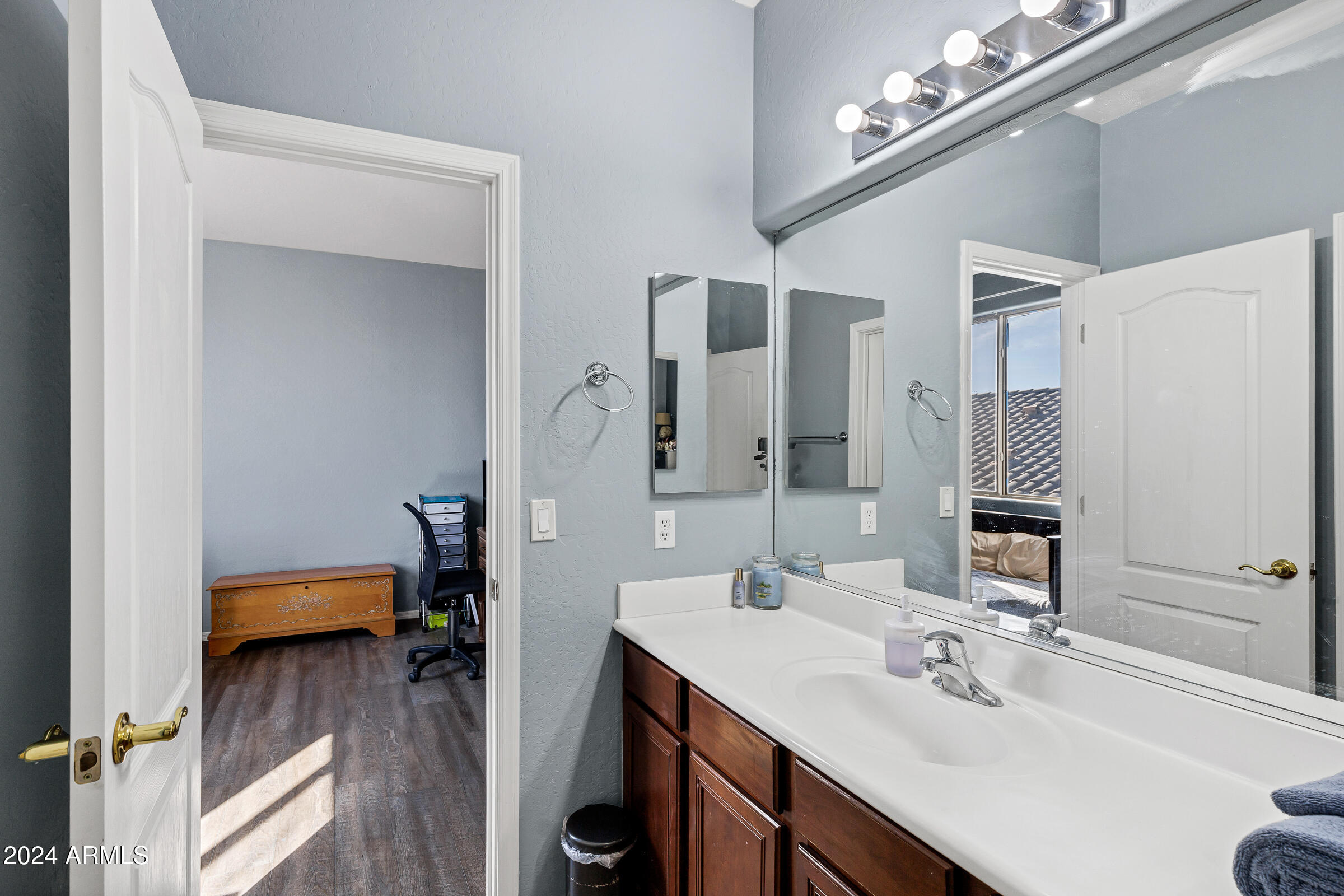 2801 West Silver Fox Way Phoenix, AZ 85045 - Photo 37 of 76 a en suite bathroom with a sink double vanity and a mirror