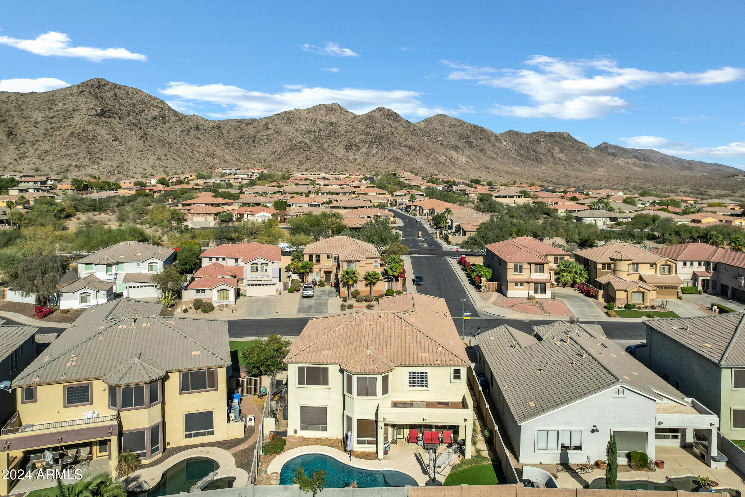 2801 West Silver Fox Way Phoenix, AZ 85045 - Photo 68 of 76 an aerial view of residential houses with a city view