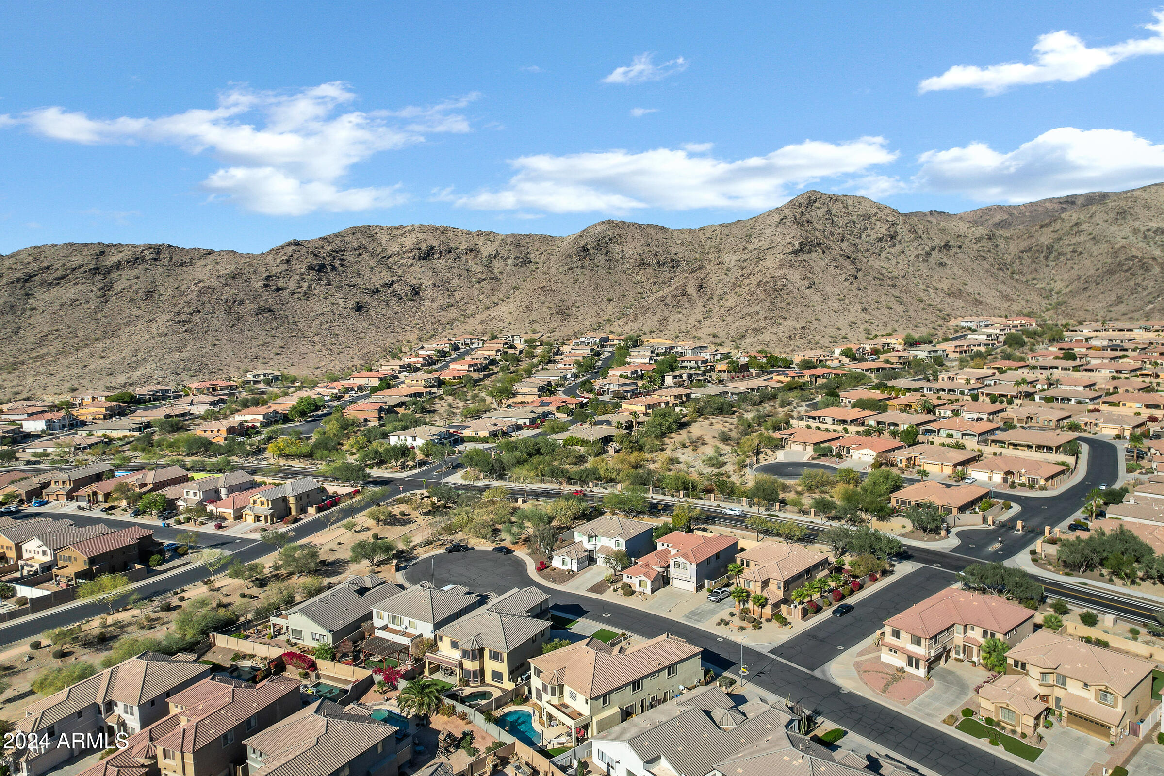 2801 West Silver Fox Way Phoenix, AZ 85045 - Photo 72 of 76 an aerial view of residential houses with outdoor space