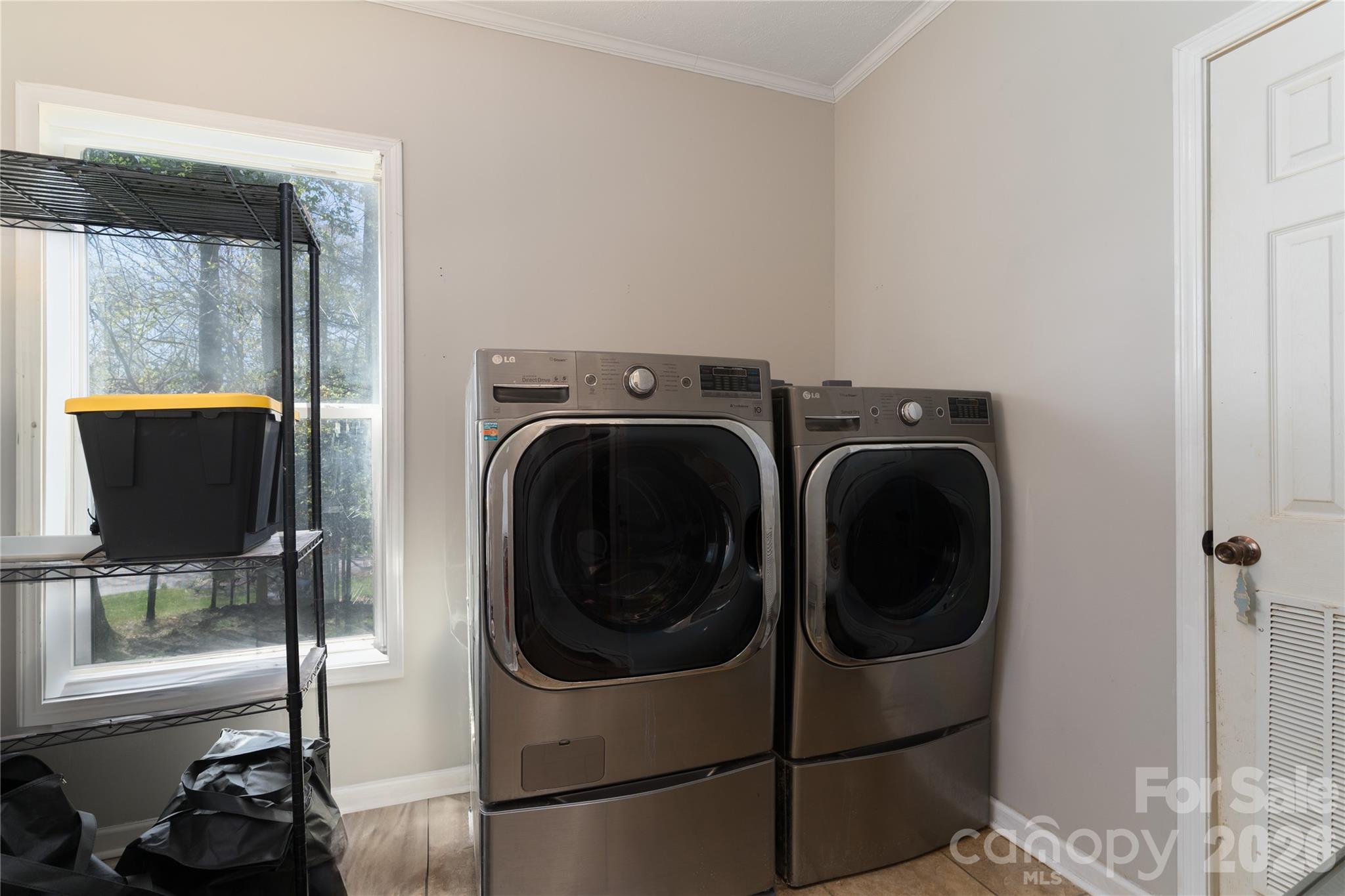 296 Stillwater Road Troutman, NC 28166 - Photo 23 of 33 a utility room with dryer and washer