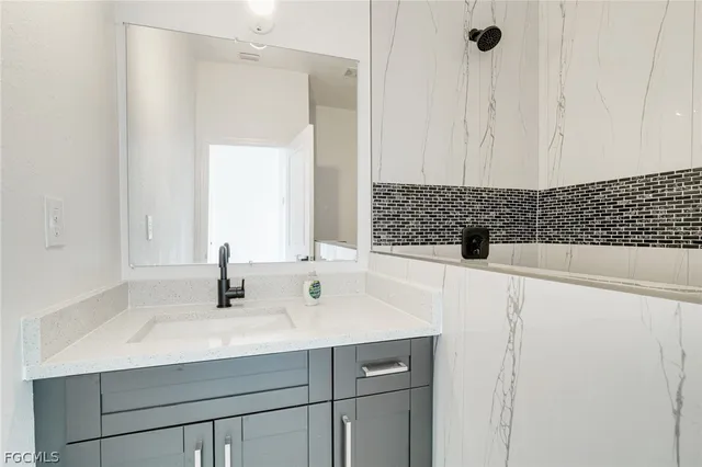 a bathroom with a sink and a mirror