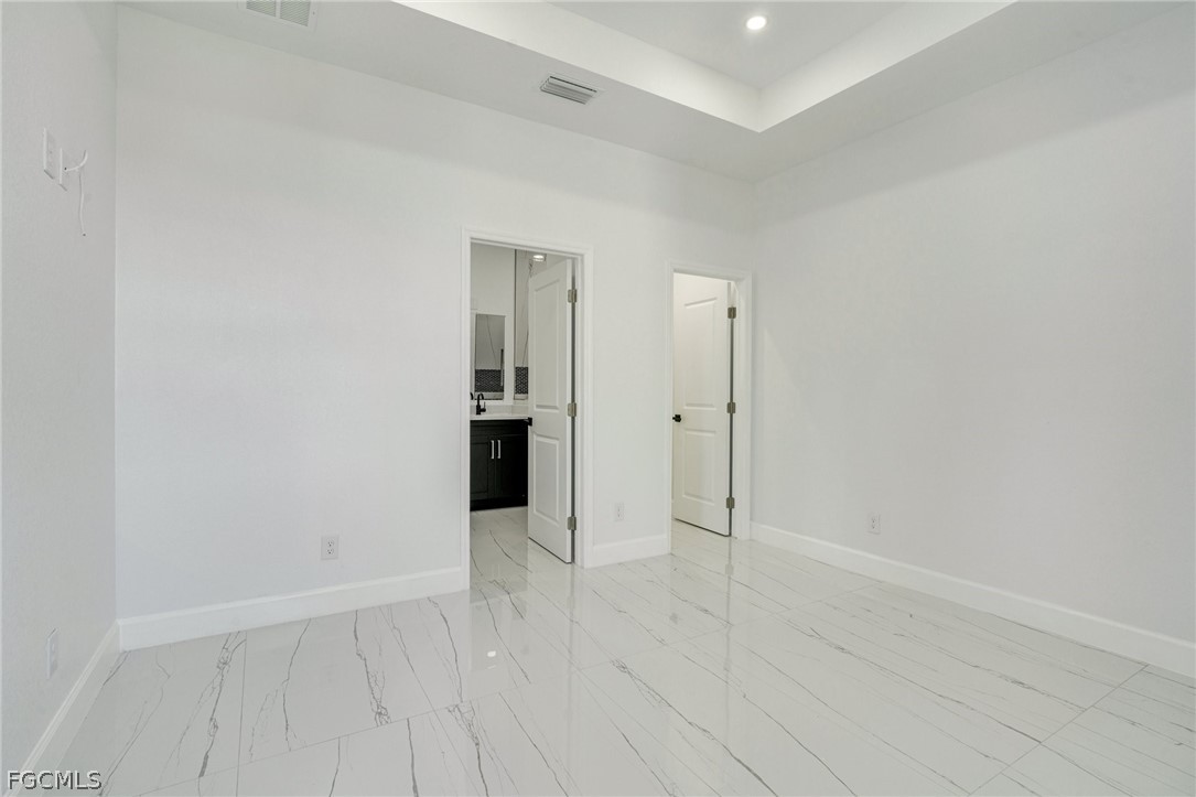 4725-4727 27th Street Southwest, Unit 4725 Lehigh Acres, FL 33973 - Photo 9 of 22 wooden floor in an empty room