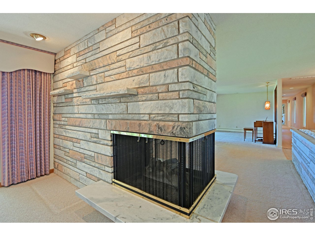 1719 Country Club Road Fort Collins, CO 80524 - Photo 16 of 39 Double-sided fireplace