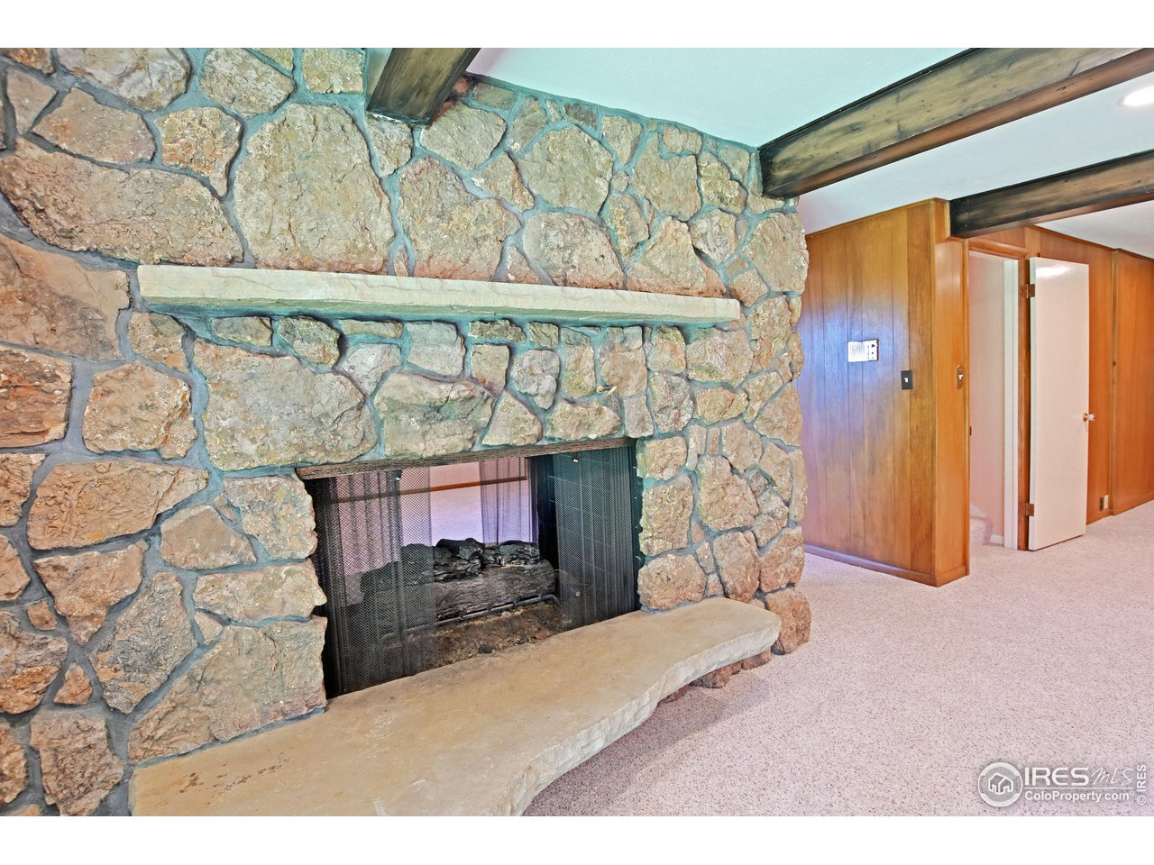 1719 Country Club Road Fort Collins, CO 80524 - Photo 27 of 39 Rec room fireplace