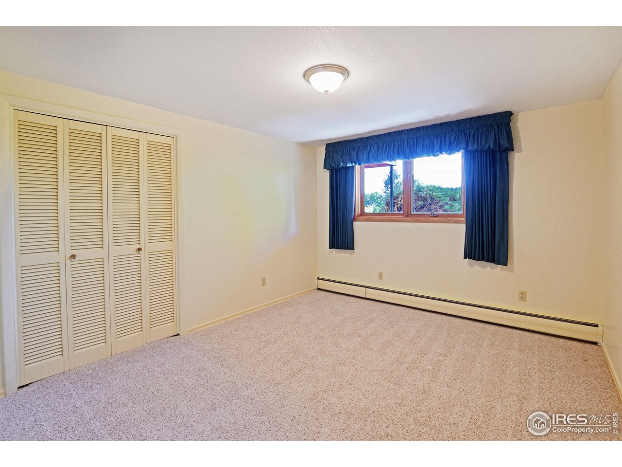 1719 Country Club Road Fort Collins, CO 80524 - Photo 29 of 39 Lower level bedroom
