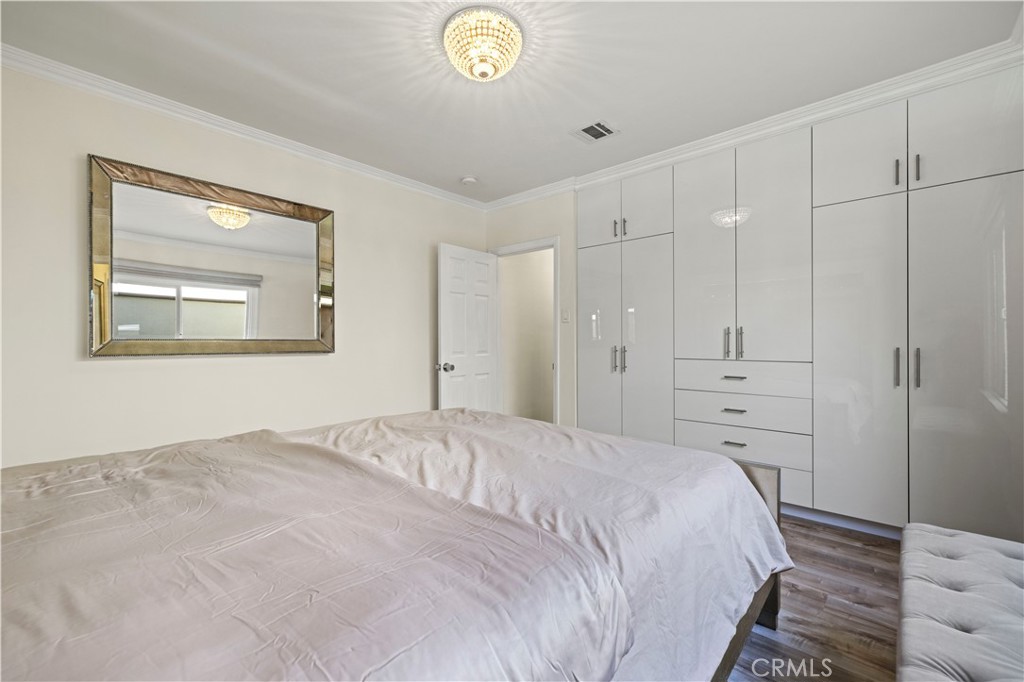 645 Glenmore Boulevard Glendale, CA 91206 - Photo 11 of 34 a bedroom with a bed and a window