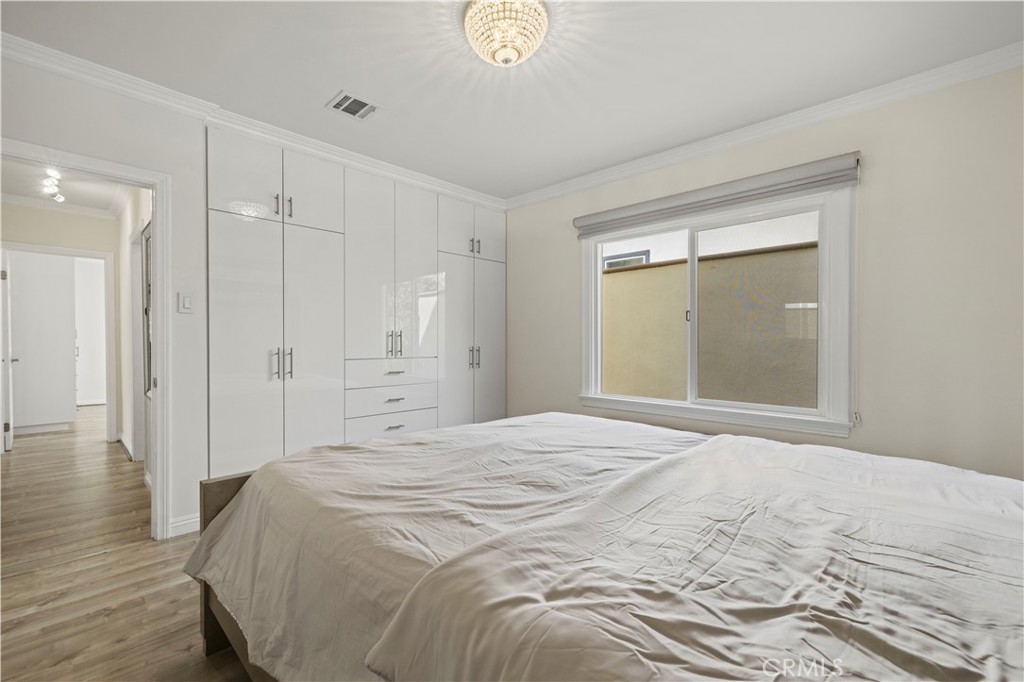 645 Glenmore Boulevard Glendale, CA 91206 - Photo 12 of 34 a spacious bedroom with a bed and a window