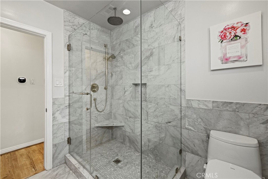 645 Glenmore Boulevard Glendale, CA 91206 - Photo 13 of 34 a bathroom with a shower and toilet