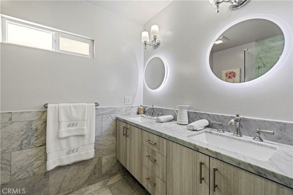 645 Glenmore Boulevard Glendale, CA 91206 - Photo 14 of 34 a spacious bathroom with a double vanity sink double and mirror