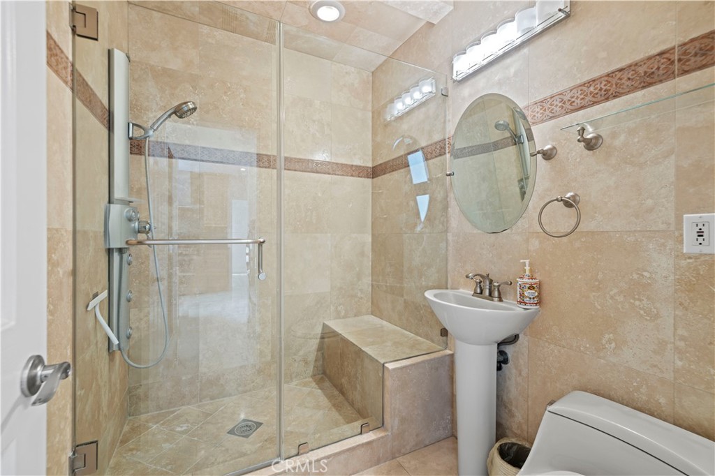 645 Glenmore Boulevard Glendale, CA 91206 - Photo 17 of 34 a bathroom with a sink toilet and shower