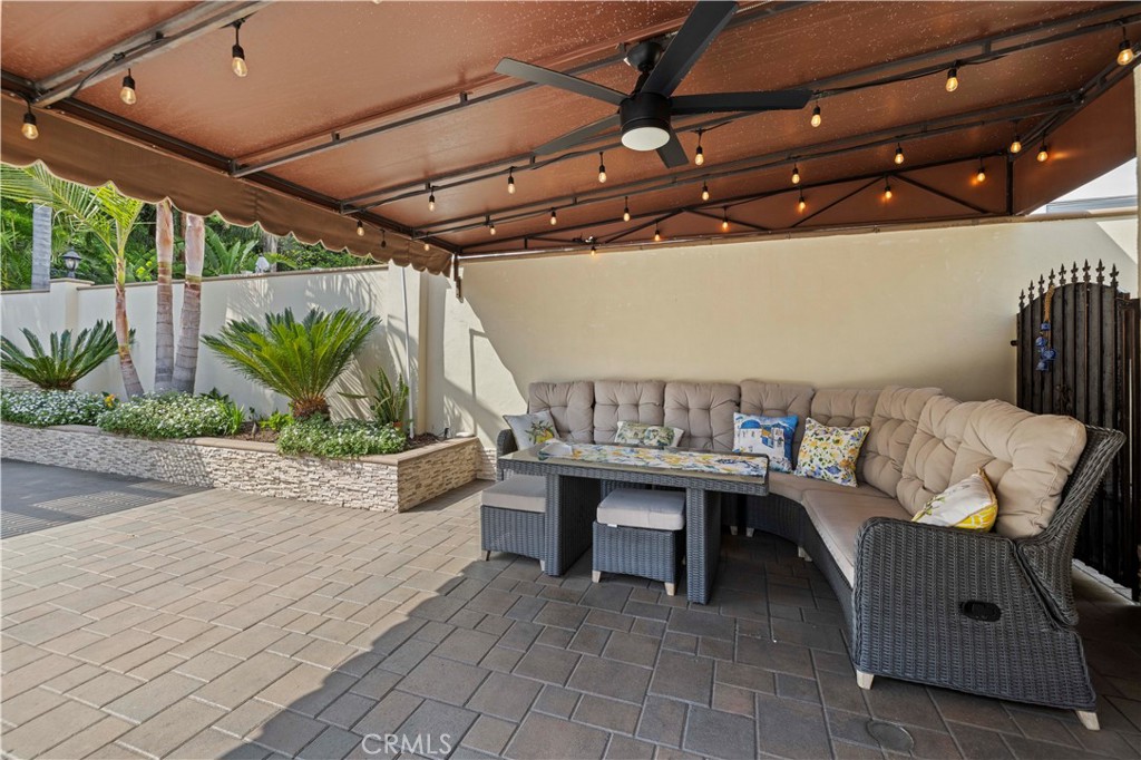 645 Glenmore Boulevard Glendale, CA 91206 - Photo 21 of 34 a view of a patio with table and chairs with wooden floor