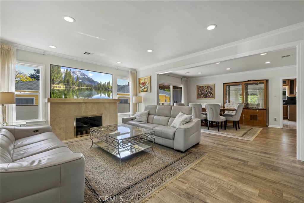 645 Glenmore Boulevard Glendale, CA 91206 - Photo 3 of 34 a living room with furniture and a fireplace