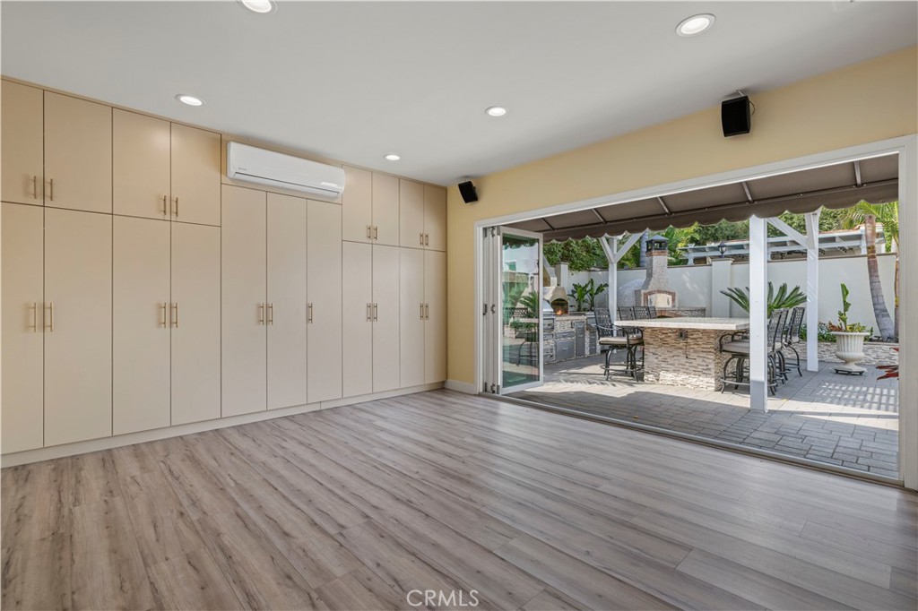 645 Glenmore Boulevard Glendale, CA 91206 - Photo 31 of 34 a view of an empty room with wooden floor and a window