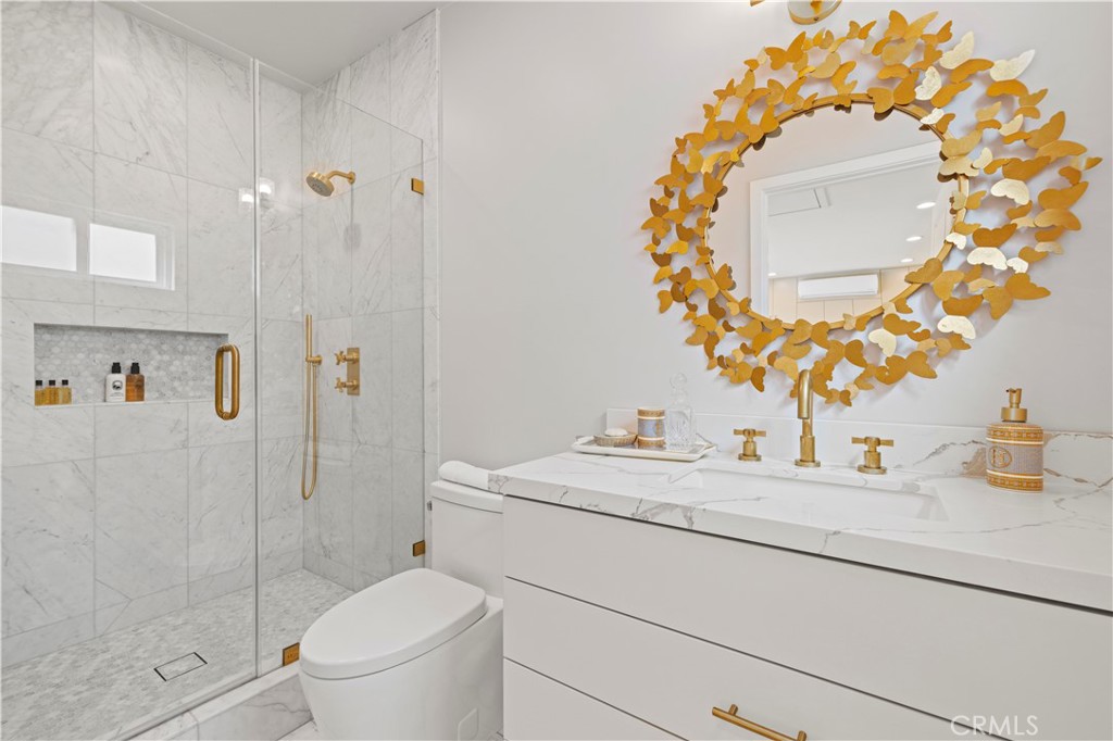 645 Glenmore Boulevard Glendale, CA 91206 - Photo 33 of 34 a bathroom with a sink mirror and toilet