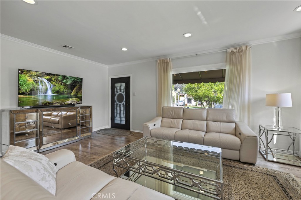 645 Glenmore Boulevard Glendale, CA 91206 - Photo 5 of 34 a living room with furniture and a flat screen tv