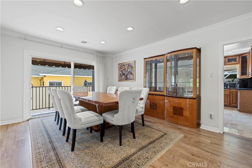 645 Glenmore Boulevard Glendale, CA 91206 - Photo 6 of 34 a view of a dining room with furniture window and wooden floor