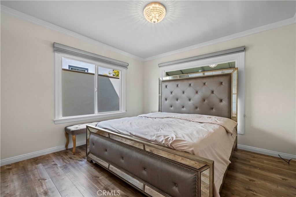 645 Glenmore Boulevard Glendale, CA 91206 - Photo 10 of 34 a bed sitting in a bedroom next to a window