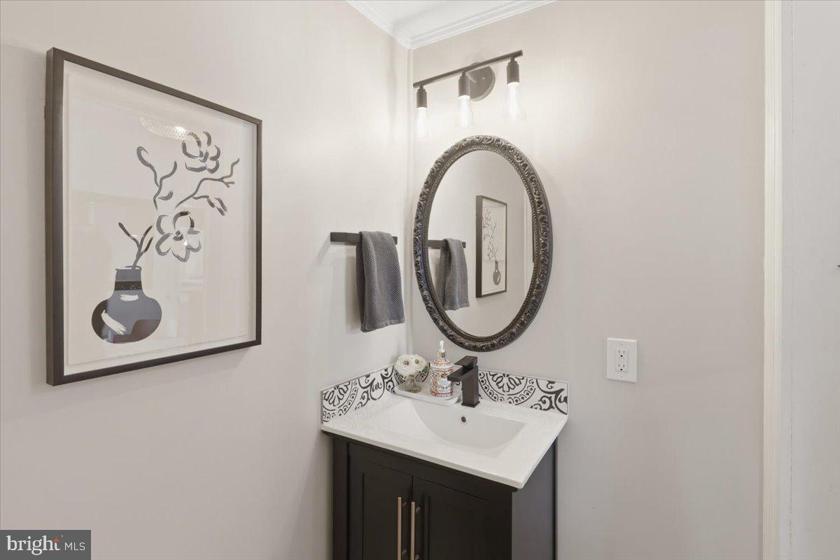 123 West 5th Street Frederick, MD 21701 - Photo 12 of 44 a bathroom with a sink and a mirror