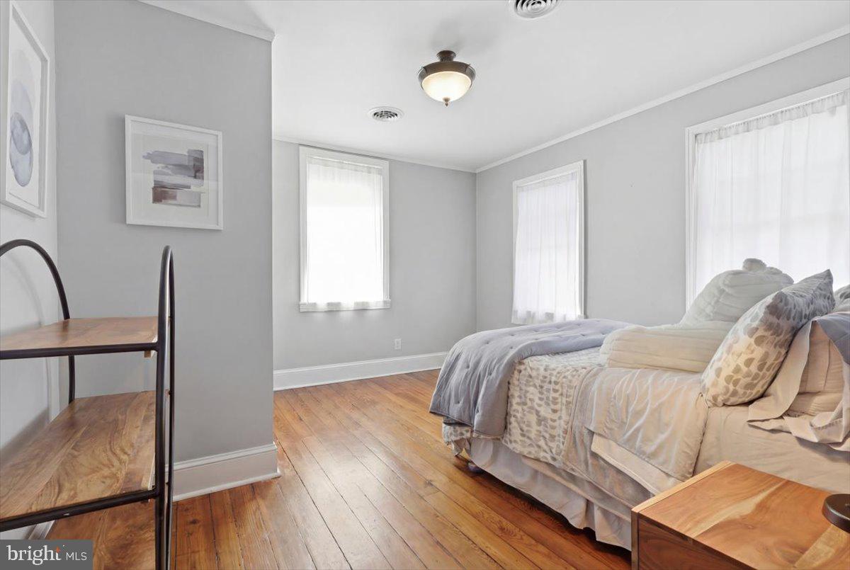 123 West 5th Street Frederick, MD 21701 - Photo 26 of 44 a bed sitting in a bedroom next to a window