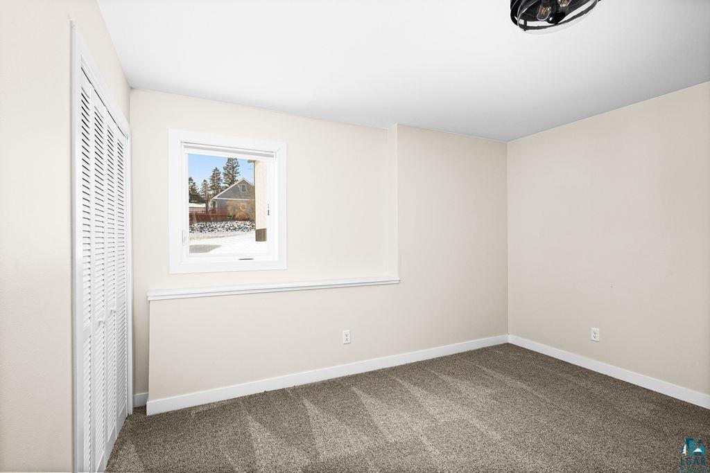 2236 Hoover Street Duluth, MN 55811 - Photo 30 of 52 Unfurnished bedroom with a closet and carpet floors