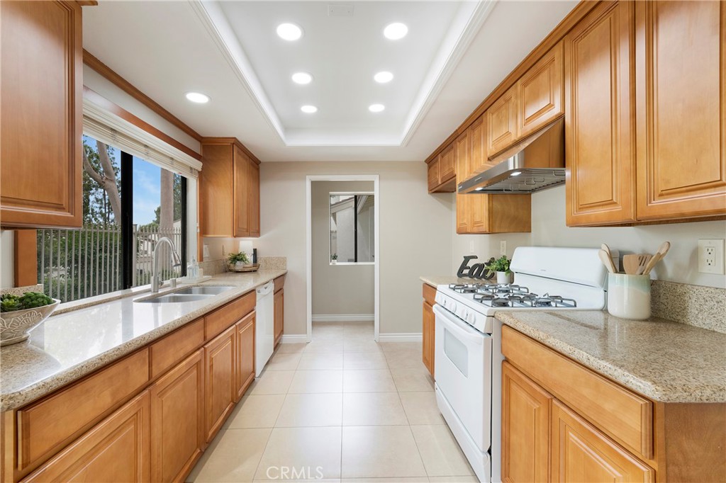 242 Mountain Court Brea, CA 92821 - Photo 12 of 54 a large kitchen with stainless steel appliances granite countertop a lot of counter space and a sink