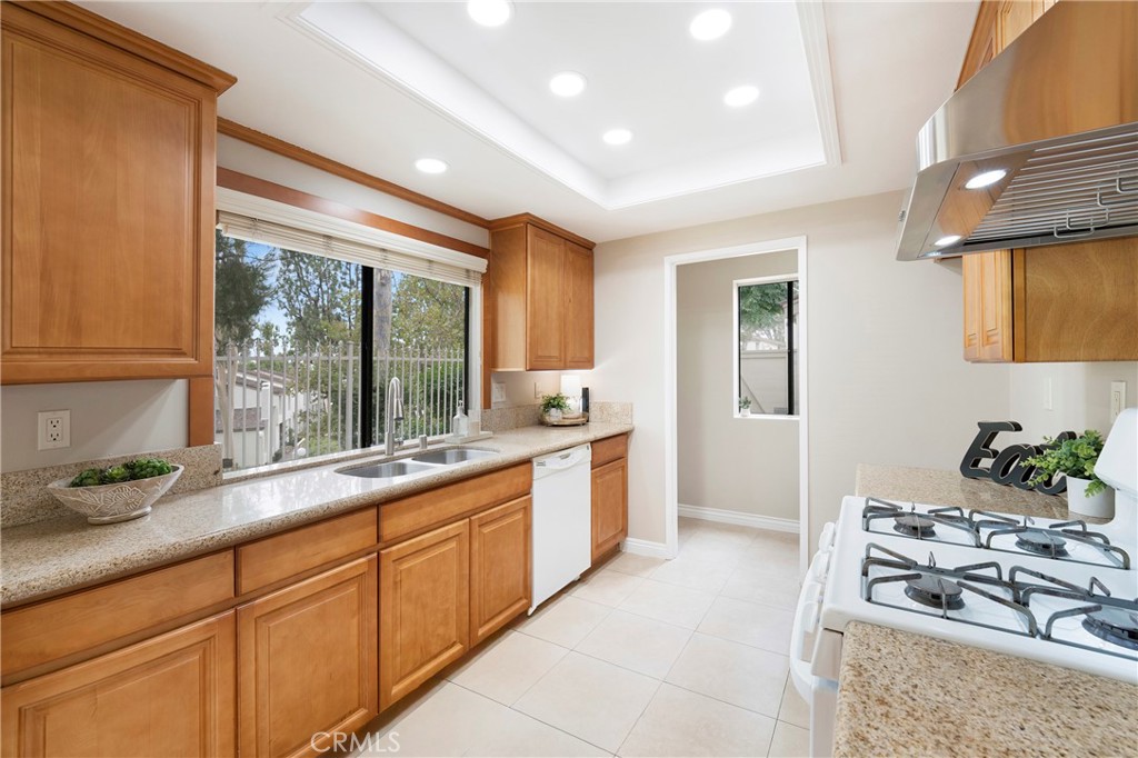 242 Mountain Court Brea, CA 92821 - Photo 14 of 54 a large kitchen with stainless steel appliances granite countertop a stove a sink and a refrigerator
