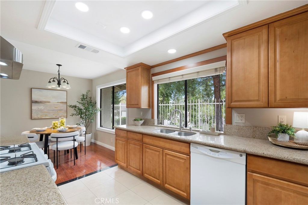 242 Mountain Court Brea, CA 92821 - Photo 15 of 54 a large kitchen with kitchen island a large window in it