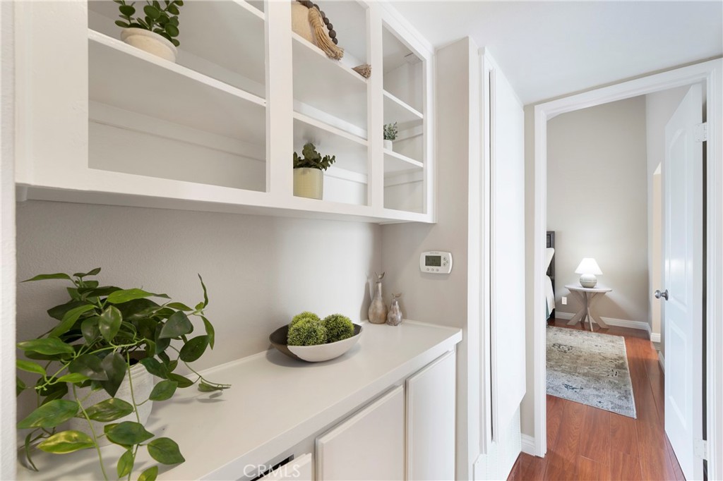 242 Mountain Court Brea, CA 92821 - Photo 27 of 54 a kitchen with a sink a stove and a wooden floor