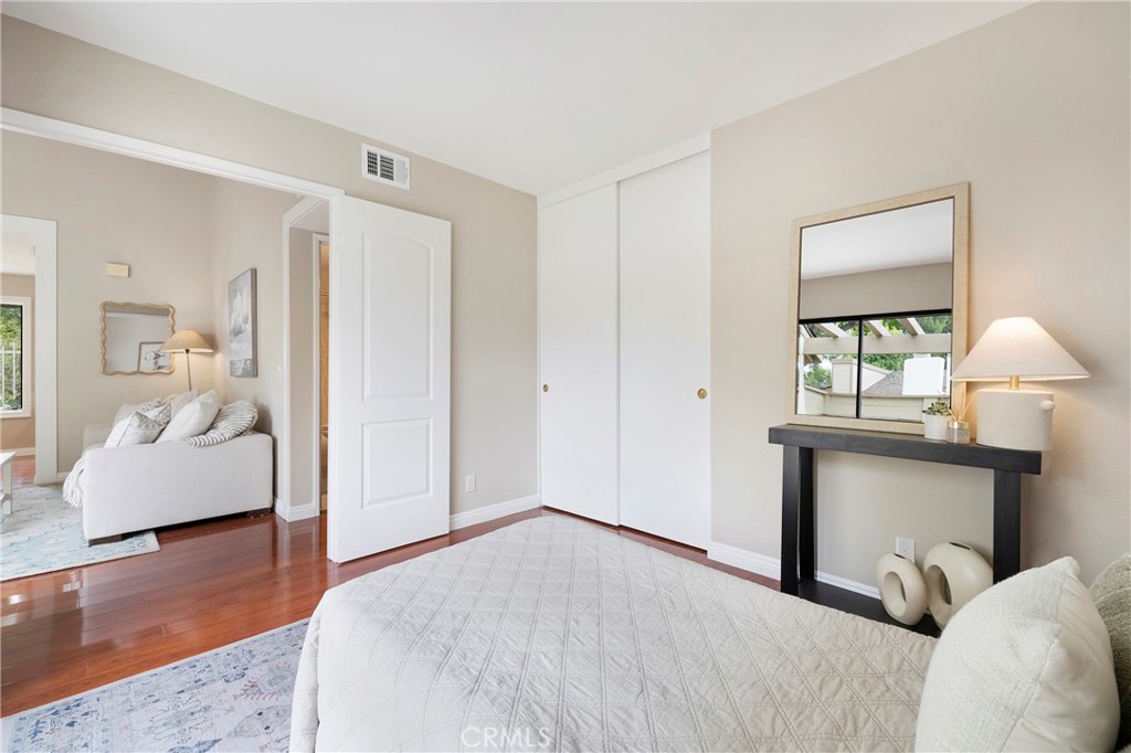 242 Mountain Court Brea, CA 92821 - Photo 30 of 54 a bedroom with a bed and a couch