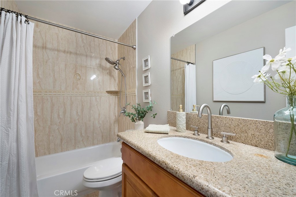 242 Mountain Court Brea, CA 92821 - Photo 32 of 54 a bathroom with a granite countertop sink toilet and shower
