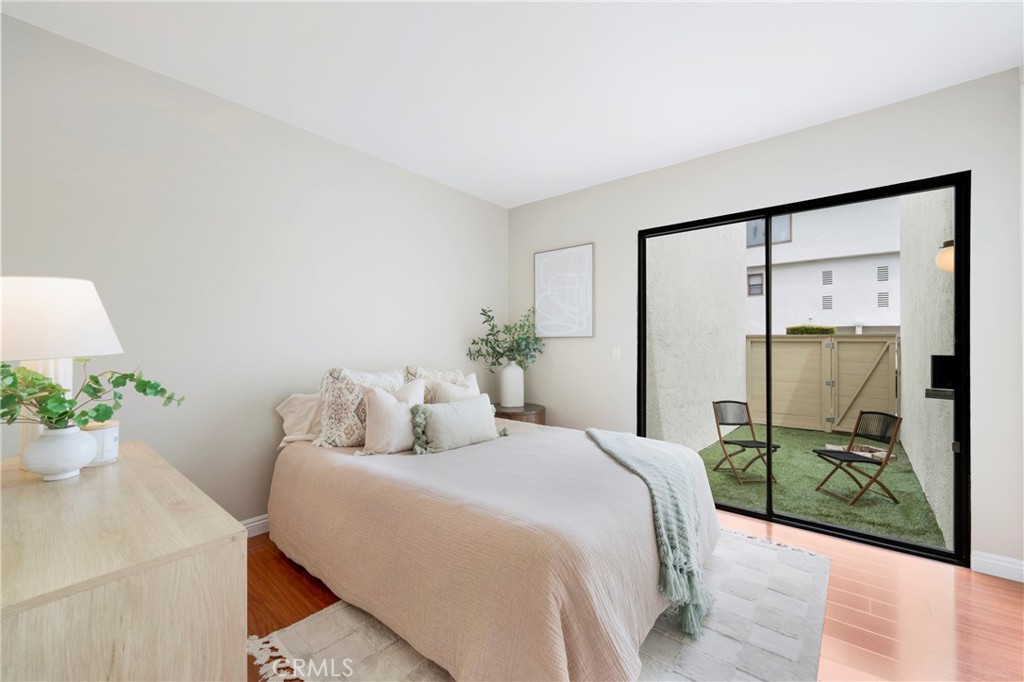 242 Mountain Court Brea, CA 92821 - Photo 33 of 54 a bedroom with a balcony a bed and a potted plant