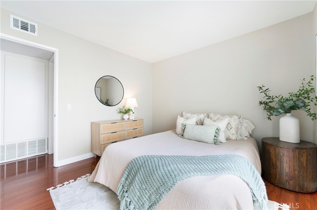 242 Mountain Court Brea, CA 92821 - Photo 34 of 54 a bedroom with a bed and wooden floor