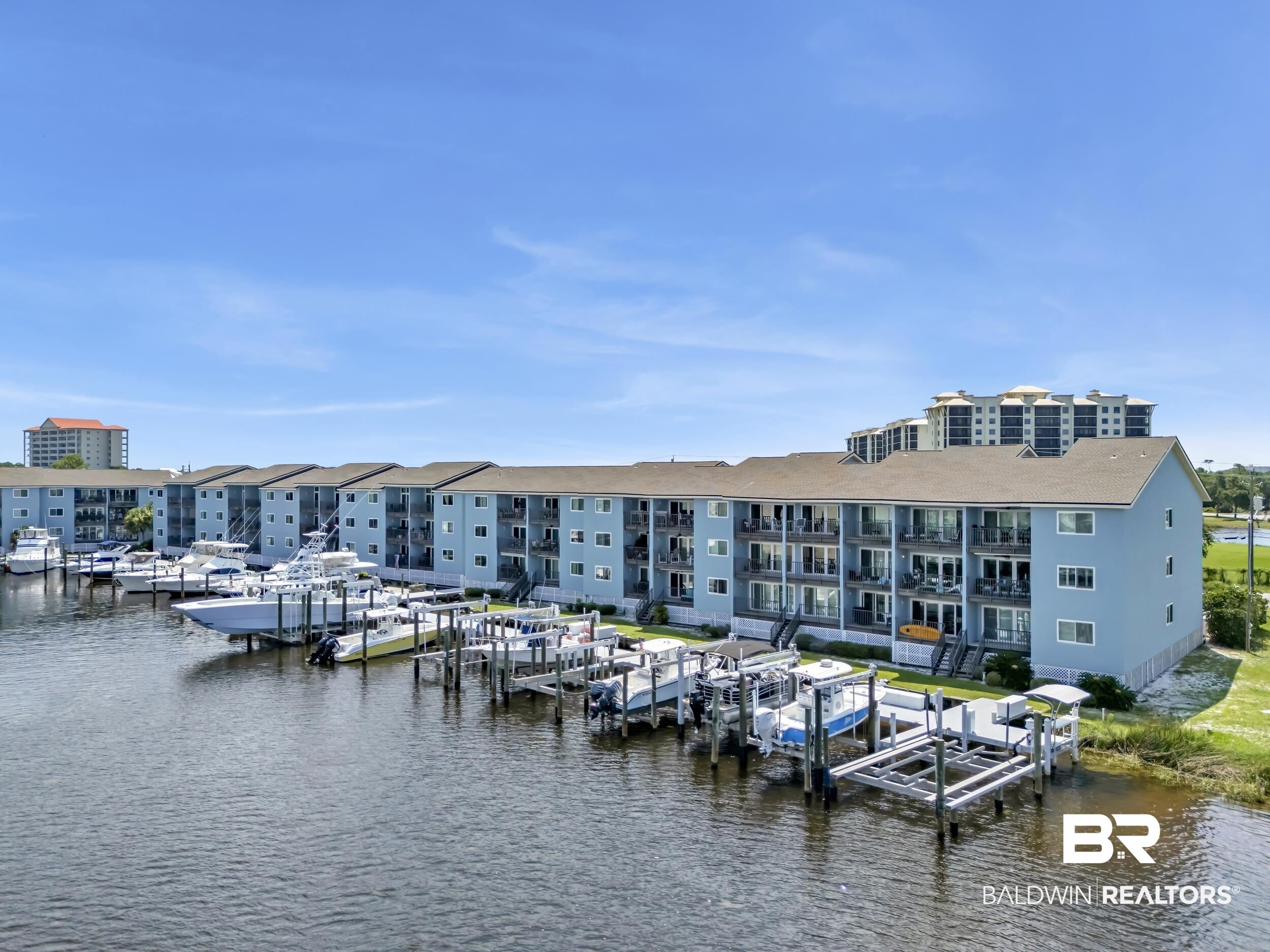14100 River Road, Unit 211 Pensacola, FL 32507 - Photo 4 of 56 Waterfront condominium complex featuring multiple boat slips and direct water access