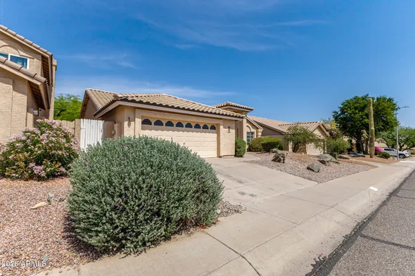 a view of a house with a street
