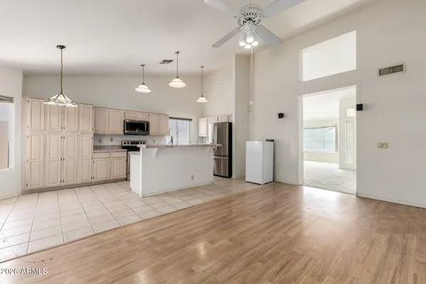 a view of a kitchen with a sink and a window