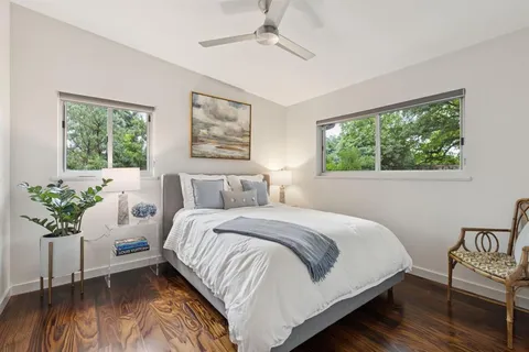 a bedroom with bed and a window