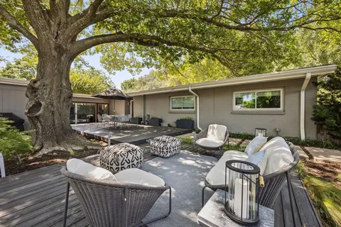 a view of a patio filled with furniture