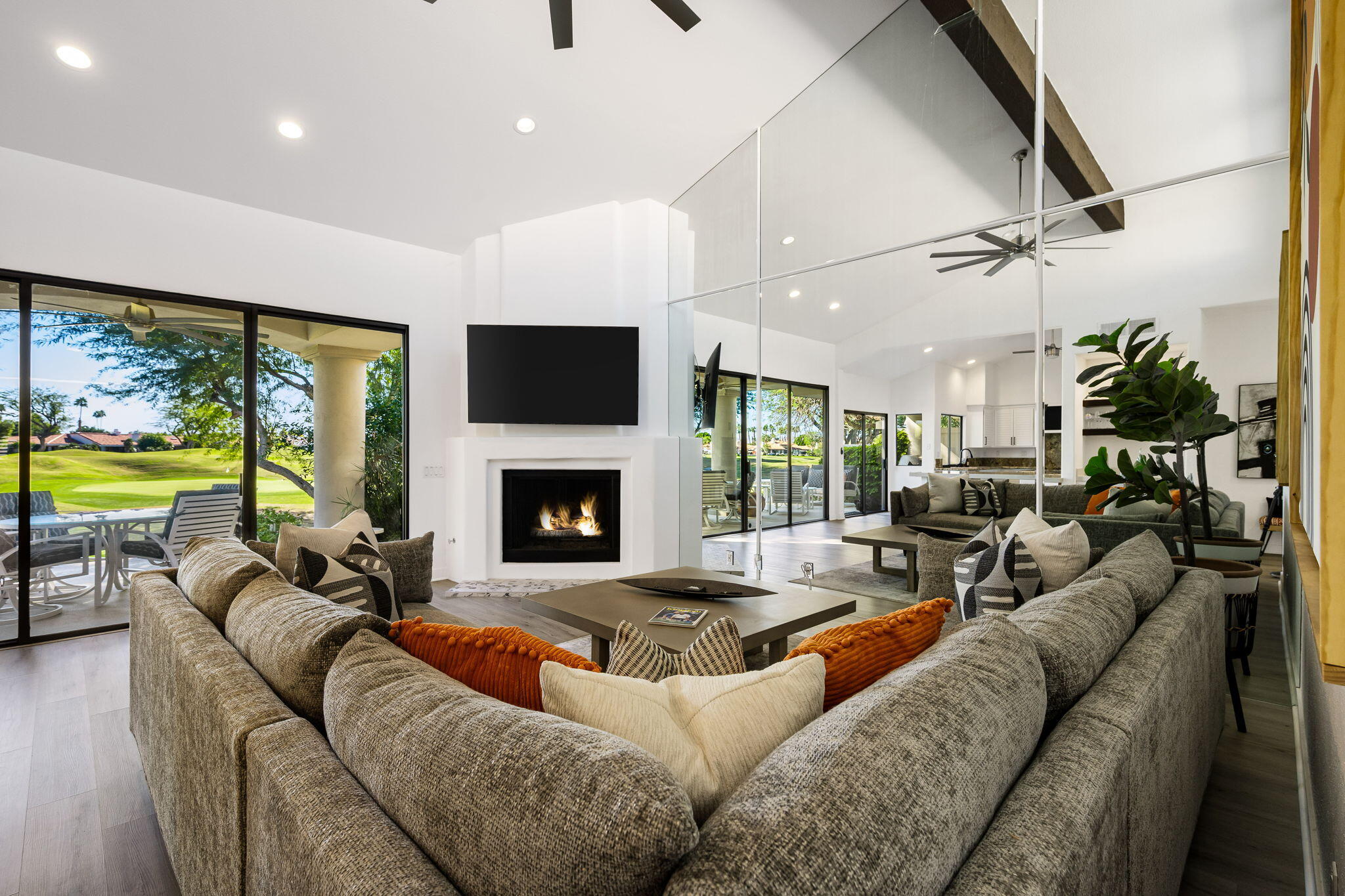 54524 Inverness Way La Quinta, CA 92253 - Photo 12 of 48 a living room with furniture fireplace and a large window