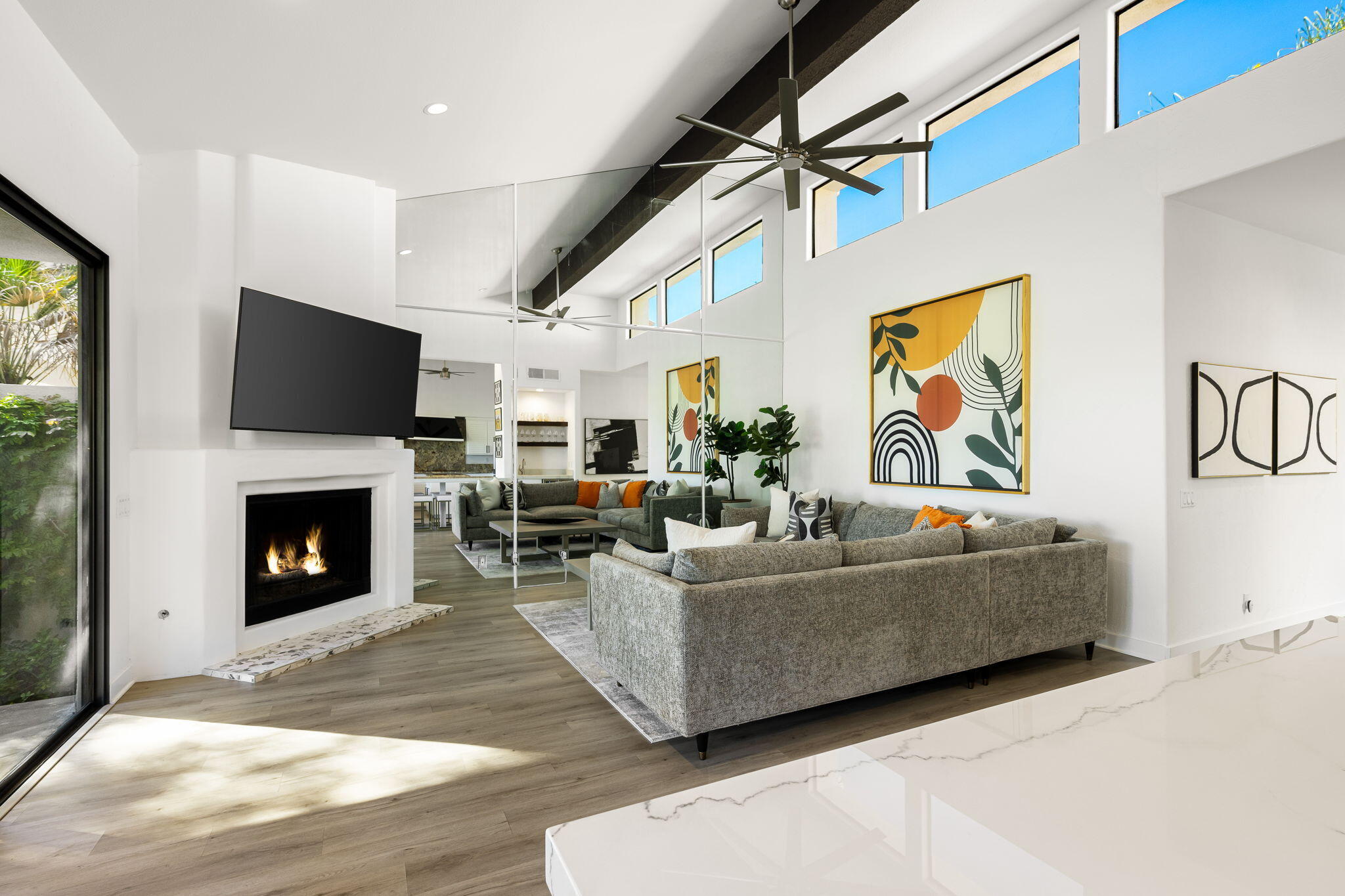 54524 Inverness Way La Quinta, CA 92253 - Photo 14 of 48 a living room with furniture a fireplace and a flat screen tv