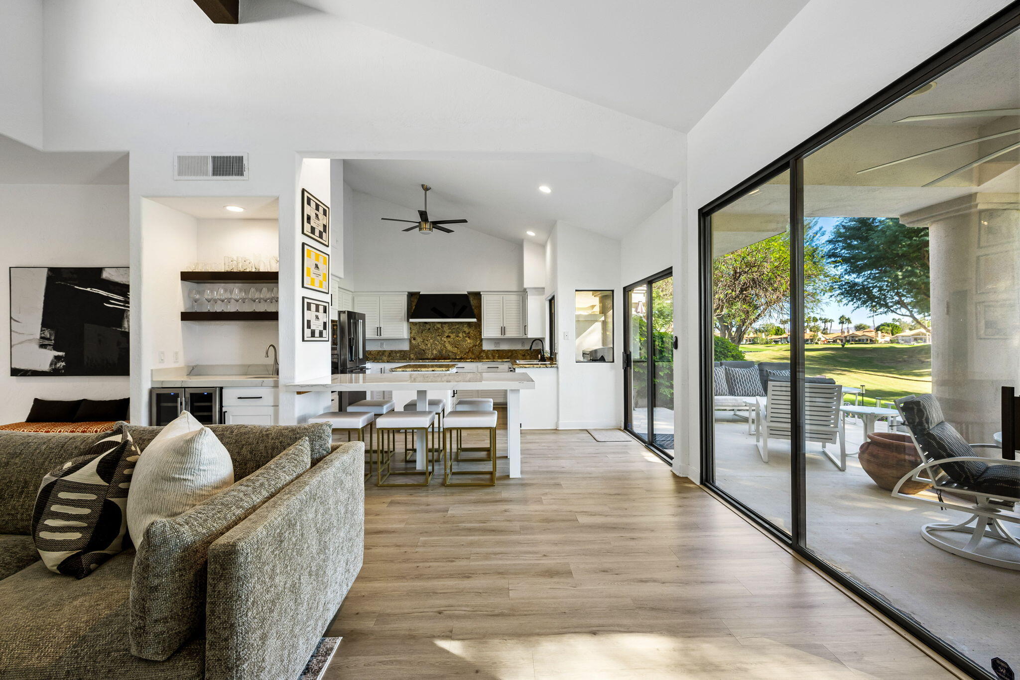 54524 Inverness Way La Quinta, CA 92253 - Photo 16 of 48 a living room with furniture wooden floor and a flat screen tv