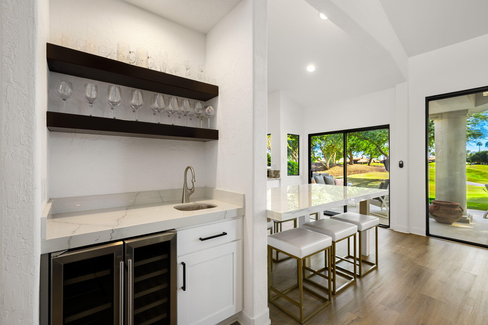 54524 Inverness Way La Quinta, CA 92253 - Photo 17 of 48 a view of a kitchen with a table and chairs in it