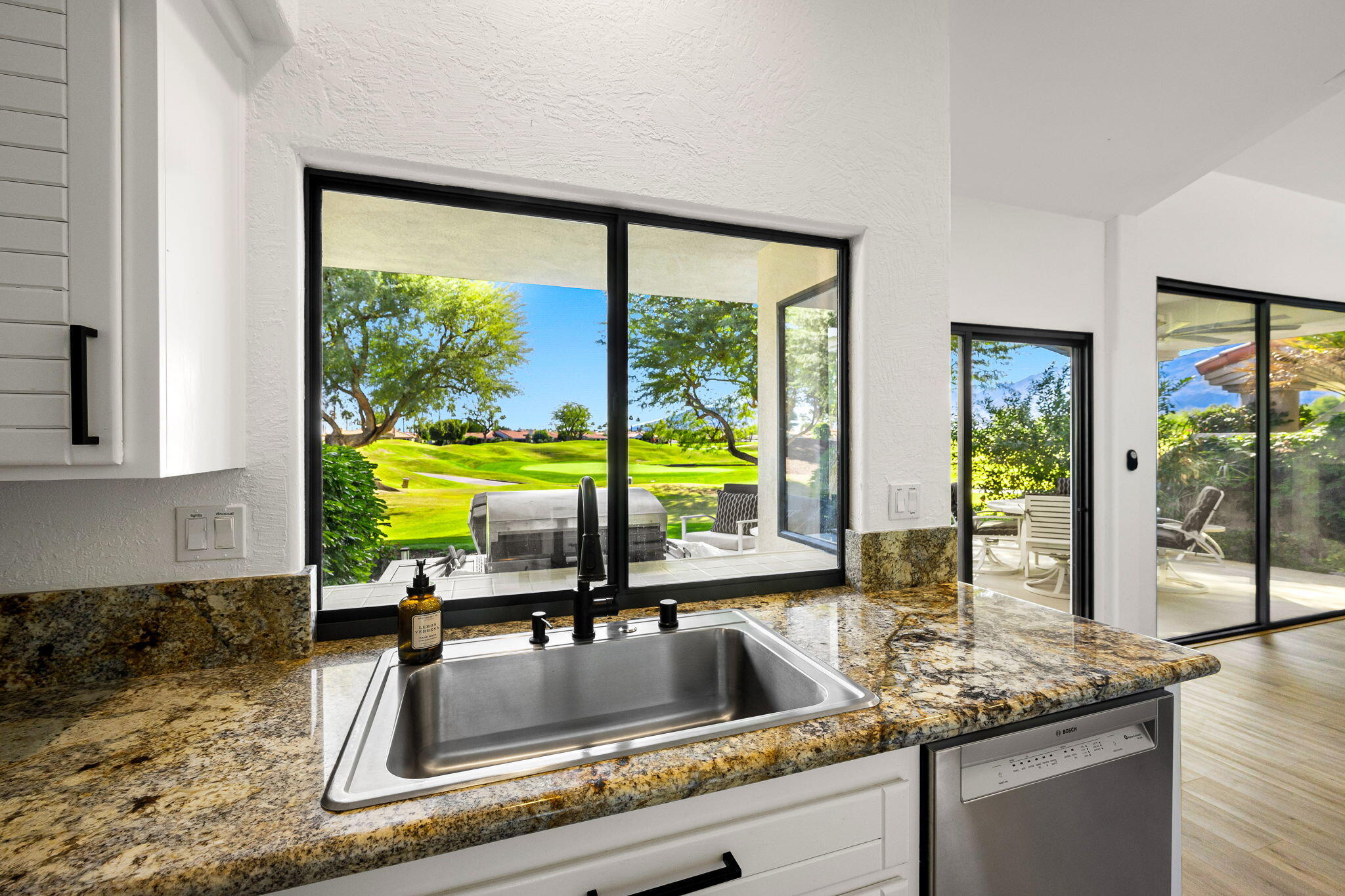 54524 Inverness Way La Quinta, CA 92253 - Photo 22 of 48 a kitchen with a sink and a large window