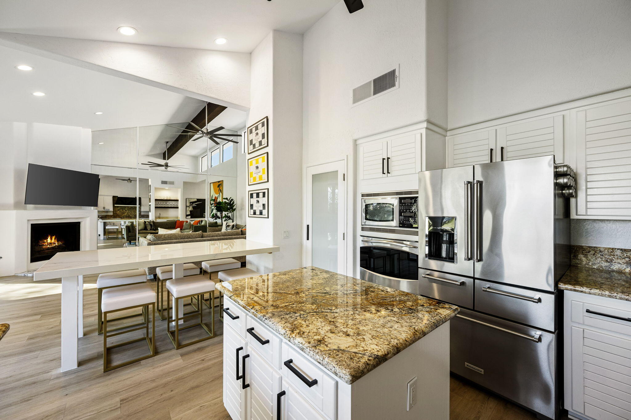 54524 Inverness Way La Quinta, CA 92253 - Photo 23 of 48 a kitchen with a refrigerator and a stove top oven