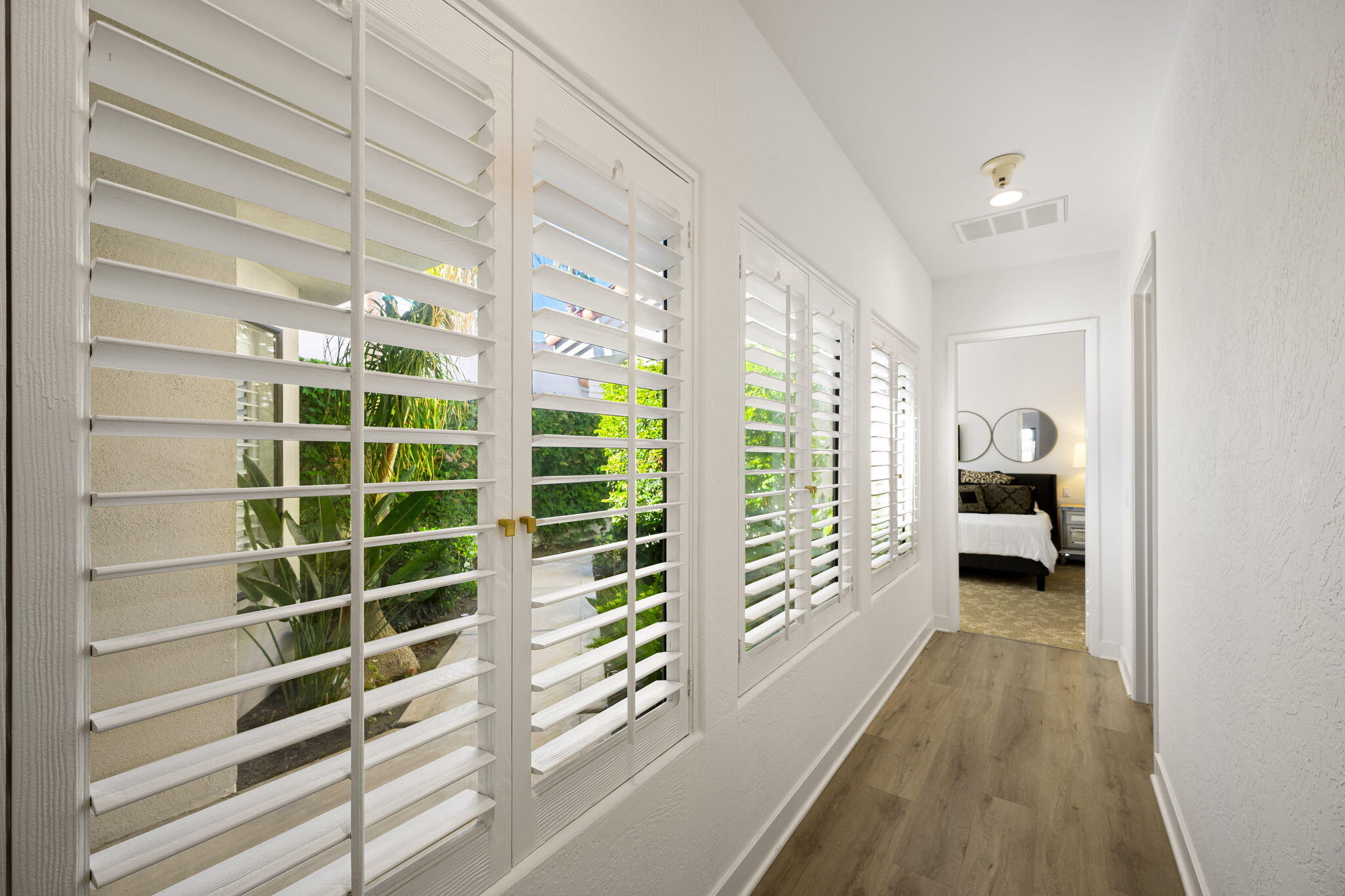 54524 Inverness Way La Quinta, CA 92253 - Photo 25 of 48 a view of a hallway with windows and stairs