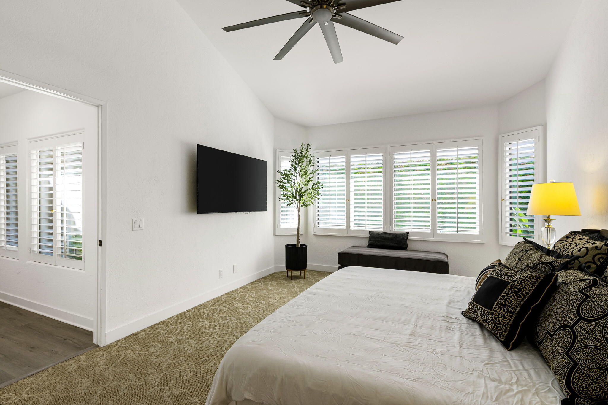 54524 Inverness Way La Quinta, CA 92253 - Photo 27 of 48 a bedroom with a bed window and a flat screen tv