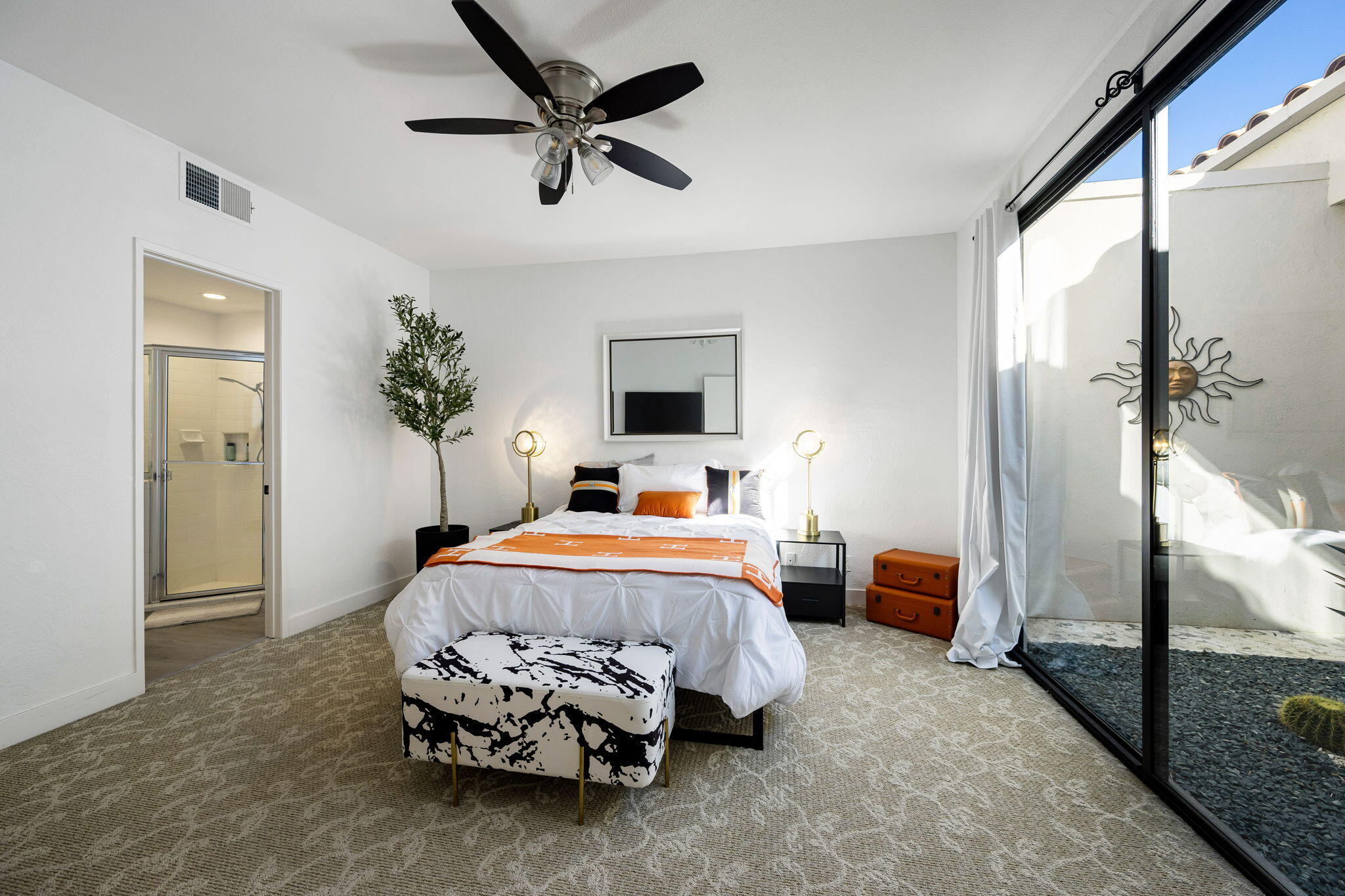 54524 Inverness Way La Quinta, CA 92253 - Photo 33 of 48 a bedroom with a bed and a chandelier