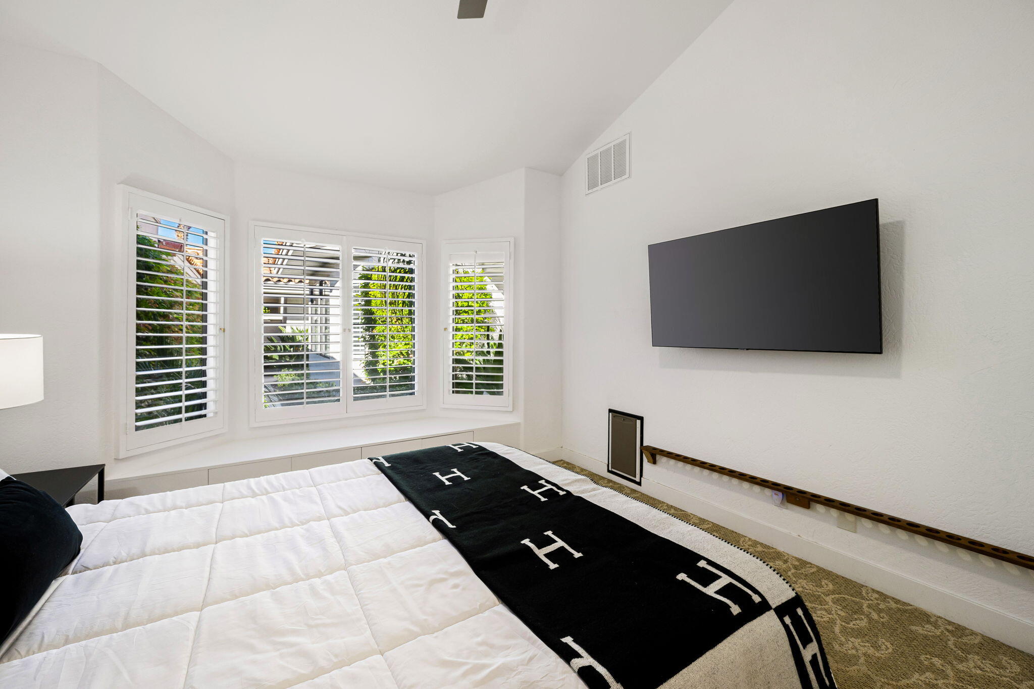 54524 Inverness Way La Quinta, CA 92253 - Photo 37 of 48 a living room with a flat screen tv and a large window